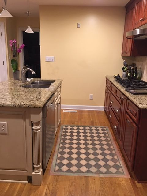 Classic Pattern 9 Checkmate - vinyl floor cloth used in a kitchen 