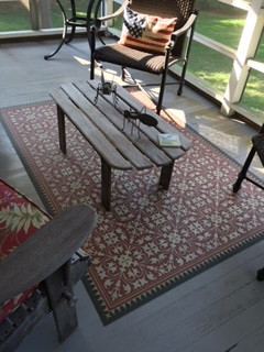 Classic Pattern 21 The Red Queen - vinyl floor cloth used on a porch 