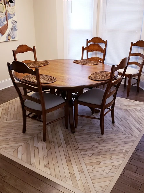 Nile Northward Rill - vinyl floor cloth , customer photo 96x96 square used in a dining room