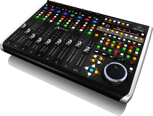 Behringer      Universal Control Surface with 9 Touch-Sensitive Motor Faders, LCD Scribble Strips and Ethernet/USB/MIDI Interface