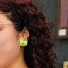 Zuri Perle client wearing 3D printed green igba aye earrings Zuri Perle client wearing 3D printed green igba aye earrings