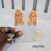 Hand holding contemporary cultural jewelry Iyun Okan Orange 3D printed symbolic statement earrings by dallas brand zuri perle Hand holding contemporary cultural jewelry Iyun Okan Orange 3D printed symbolic statement earrings by dallas brand zuri perle