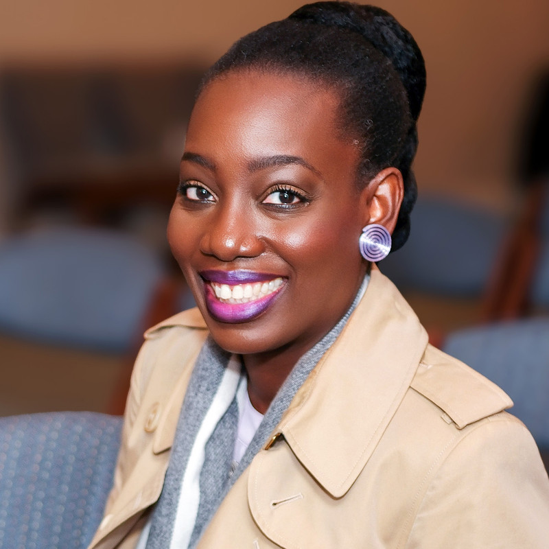 Atinuke Adeleke Artist wearing 3D printed purple Igba Aye earrings by brand zuri perle Atinuke Adeleke Artist wearing 3D printed purple Igba Aye earrings by brand zuri perle