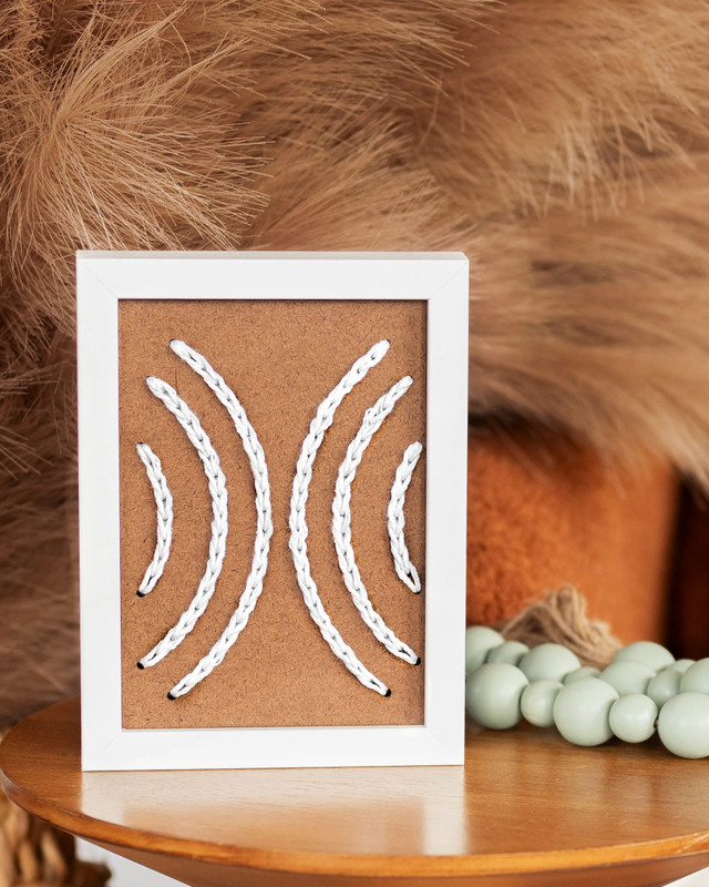 Pin Pin Symbol white embroidery on wood home decor contemporary wall art by Dallas based brand Zuri Perle