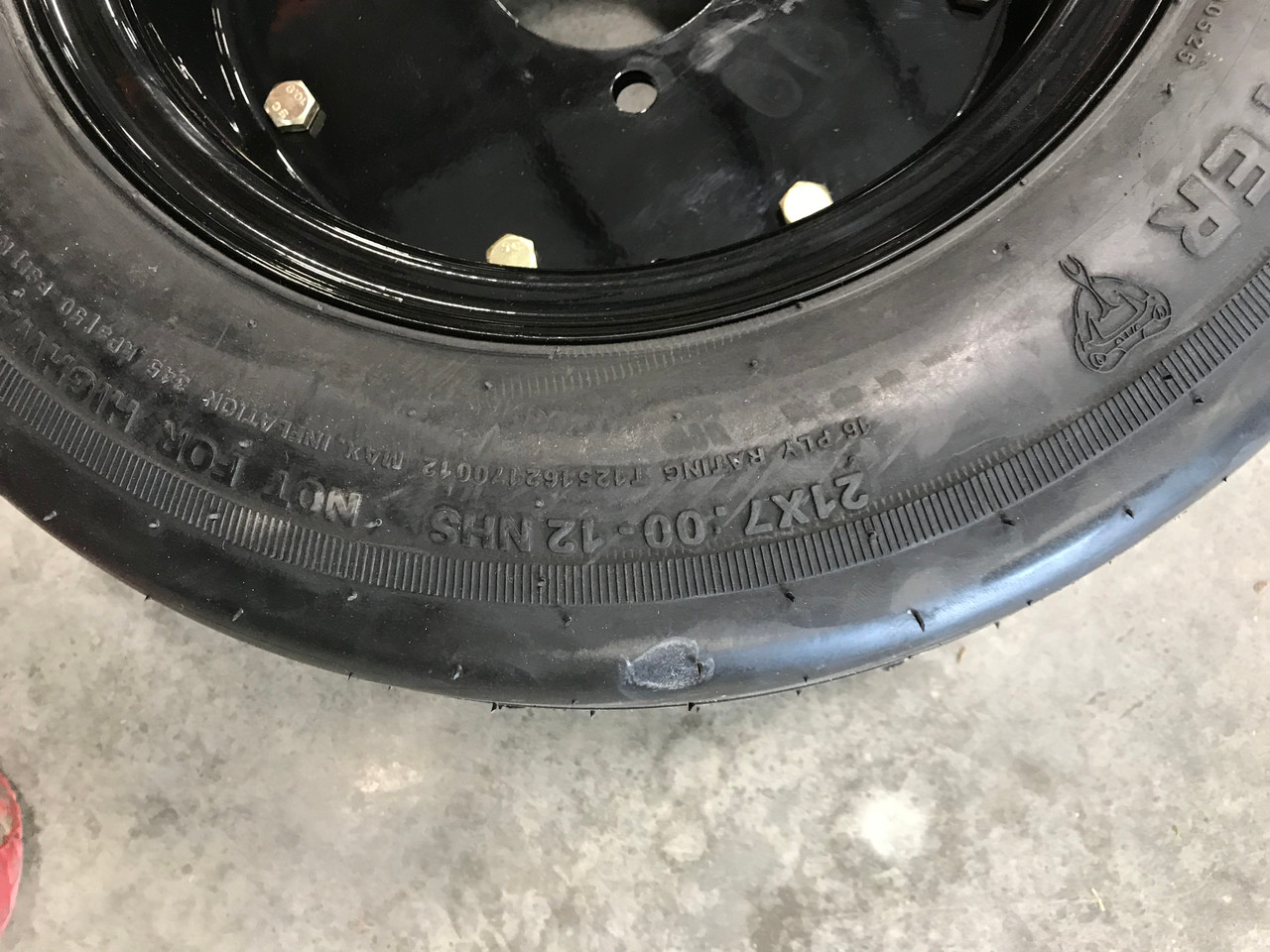 21 7.00 12 Foam Filled Bushmaster Bush Hog 4 Lug RIM 16ply Rib Tire