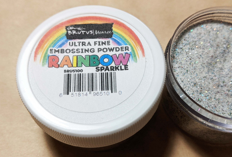 Rainbow sparkle embossing powder. Once heat melted it dries clear with rainbow glitter sparkle