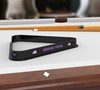TCU Horned Frogs billiard triangle displayed on a pool table beneath billiard cues, showcasing the black frame and purple TCU Horned Frogs graphics in a game room setting.