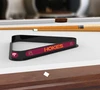 Virginia Tech Hokies billiard triangle displayed on a pool table beneath billiard cues, showcasing the black frame, maroon and orange Hokies graphics, and Virginia Tech branding in a game room setting.