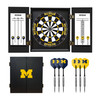 University of Michigan Wolverines dart cabinet set featuring an open cabinet with dartboard, scoreboards, darts, yellow flights, and a black cabinet door with the maize Michigan M logo.