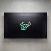 South Florida Bulls pool table cover shown from above, featuring a black cover design with the green and gold USF Bulls logo centered on the surface. This NCAA billiard table cover is designed to protect the table while showcasing University of South Florida team pride.