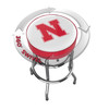 Nebraska Cornhuskers chrome bar stool shown from above, featuring the round team logo seat and a 360-degree swivel design. This Nebraska bar stool adds Cornhuskers team pride and functional seating to a home bar, game room, fan cave, or pool room.