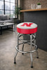 Nebraska Cornhuskers 30" chrome bar stool displayed in a home entertainment setting, featuring a red and white team logo seat with a polished chrome base. This college team stool is perfect for adding Nebraska spirit to a fan cave, home bar, pool room, or game room.