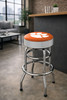 Clemson Tigers 30" chrome bar stool displayed in a home entertainment setting, featuring an orange and white team logo seat with a polished chrome base. This college team stool is perfect for adding Clemson spirit to a fan cave, home bar, pool room, or game room.