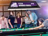 Lifestyle view of the TCU Horned Frogs 42-inch hanging billiard table light installed above a pool table, demonstrating its appearance in a game room, billiard room, home bar, or Horned Frogs fan cave.