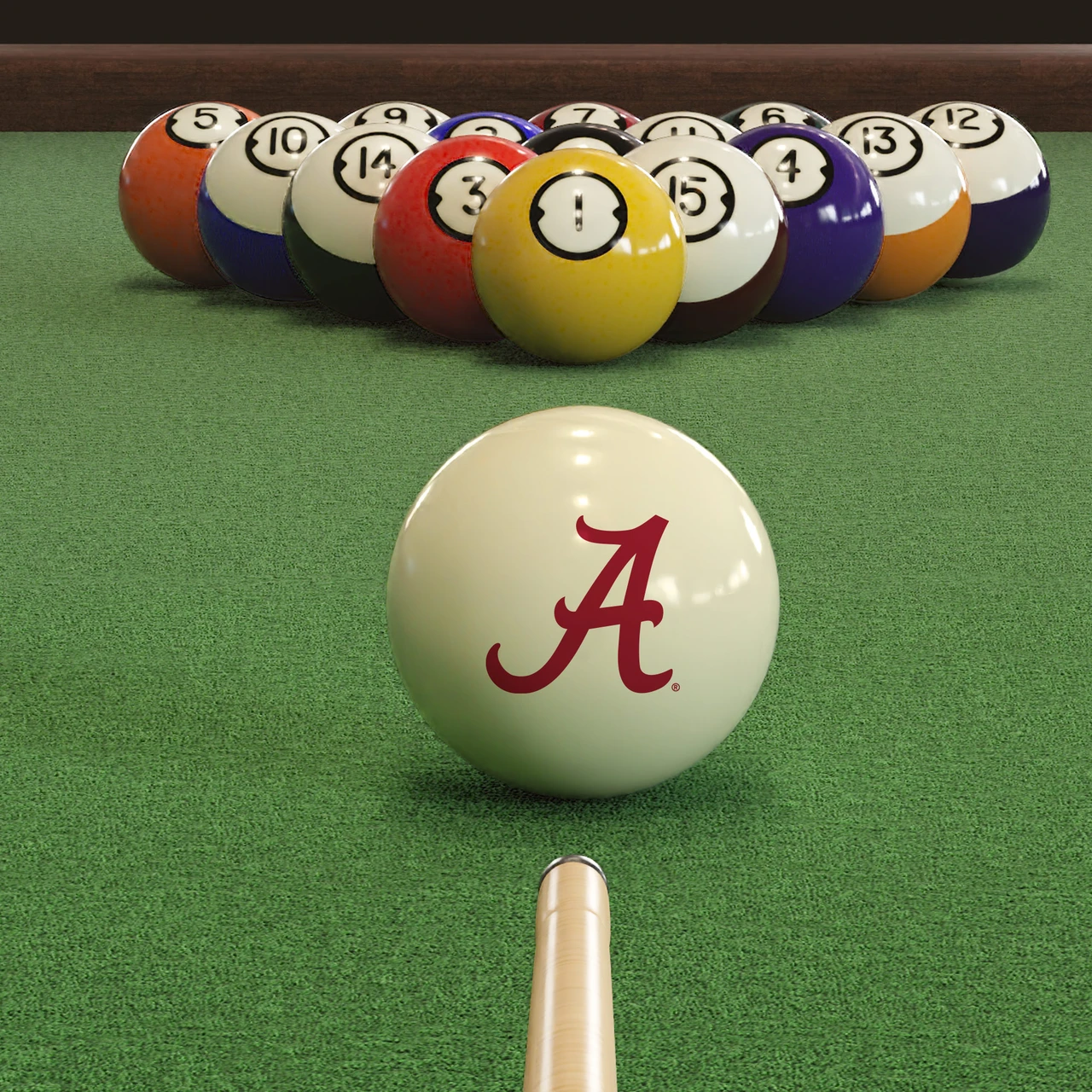 Alabama Crimson Tide cue ball positioned on green pool table felt in front of a racked set of billiard balls, featuring the crimson script “A” logo with a pool cue lined up for the break.