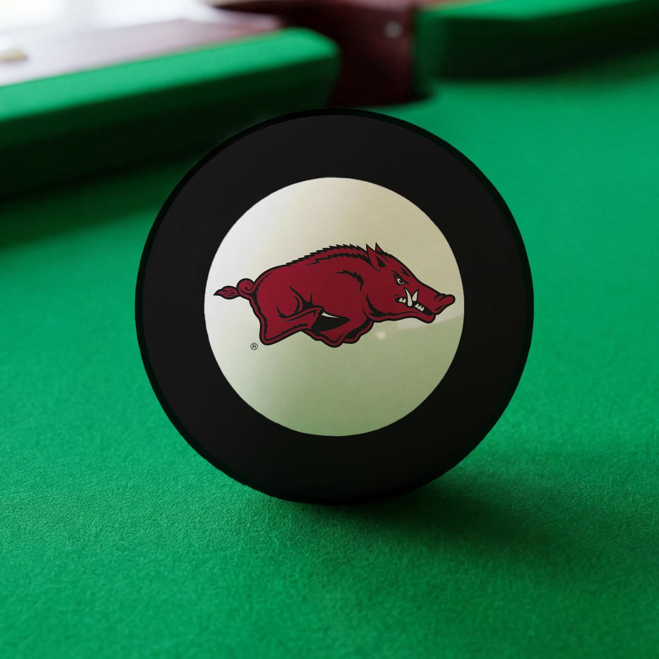 Arkansas Razorbacks Eight Ball displayed on green pool table felt, featuring the cardinal red Razorback hog logo inside the white center circle of a classic black billiard Eight Ball.