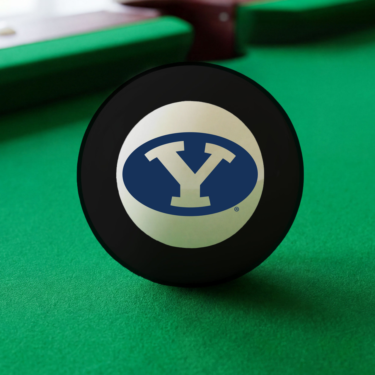 BYU Cougars Eight Ball displayed on green pool table felt, featuring the navy blue and white BYU Oval Y logo inside the white center circle of a classic black billiard Eight Ball.