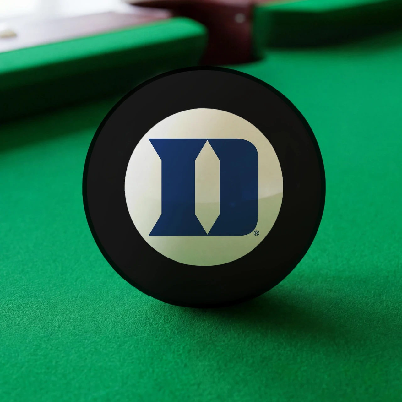 Duke Blue Devils Eight Ball displayed on green pool table felt, featuring the blue Duke D logo inside the white center circle of a classic black billiard Eight Ball.