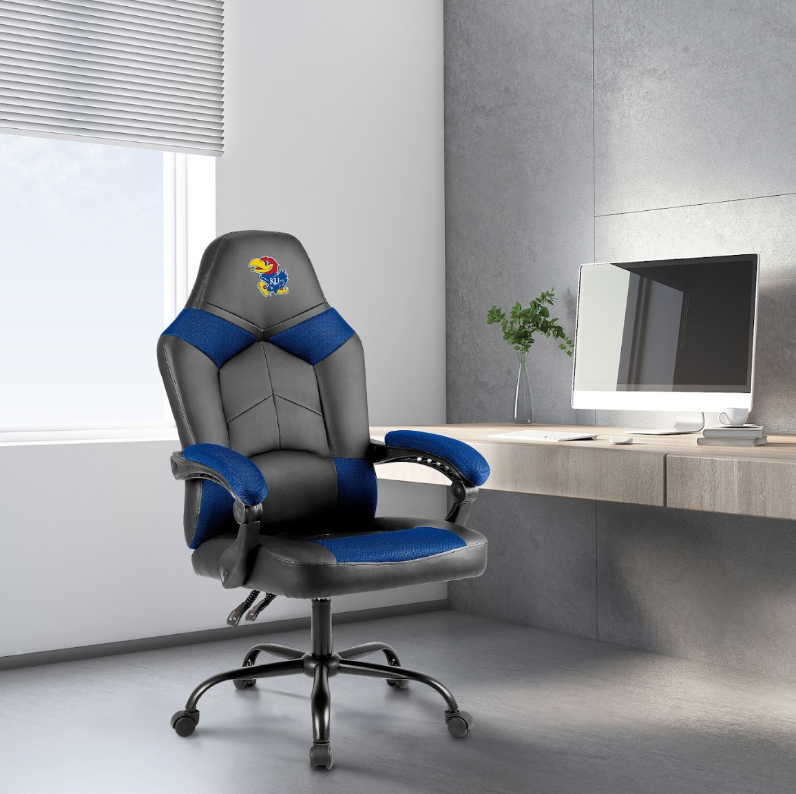 Kansas Jayhawks oversized blue gaming chair shown in a home office setting