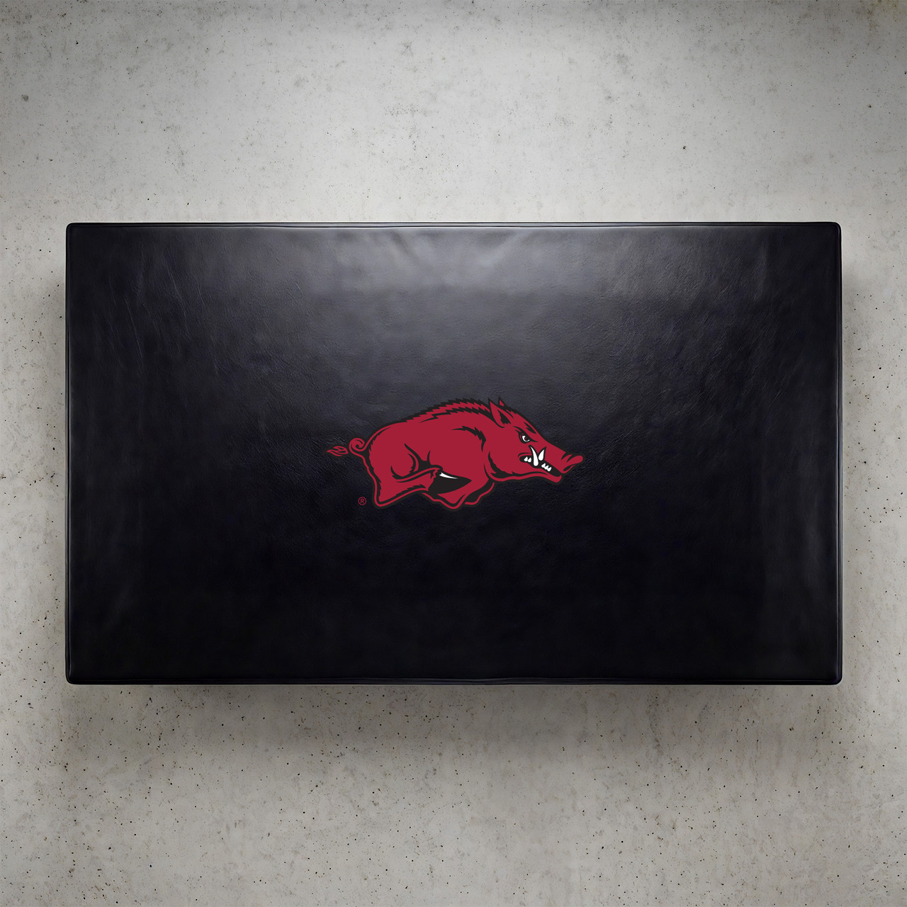 Arkansas Razorbacks pool table cover shown from above, featuring a black cover design with the red Razorbacks hog logo centered on the surface. This NCAA billiard table cover is designed to protect the table while showcasing University of Arkansas team pride.