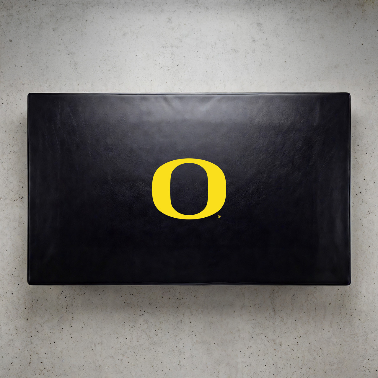 Oregon Ducks pool table cover shown from above, featuring a black cover design with the yellow Oregon “O” logo centered on the surface. This NCAA billiard table cover is designed to protect the table while showcasing University of Oregon team pride.