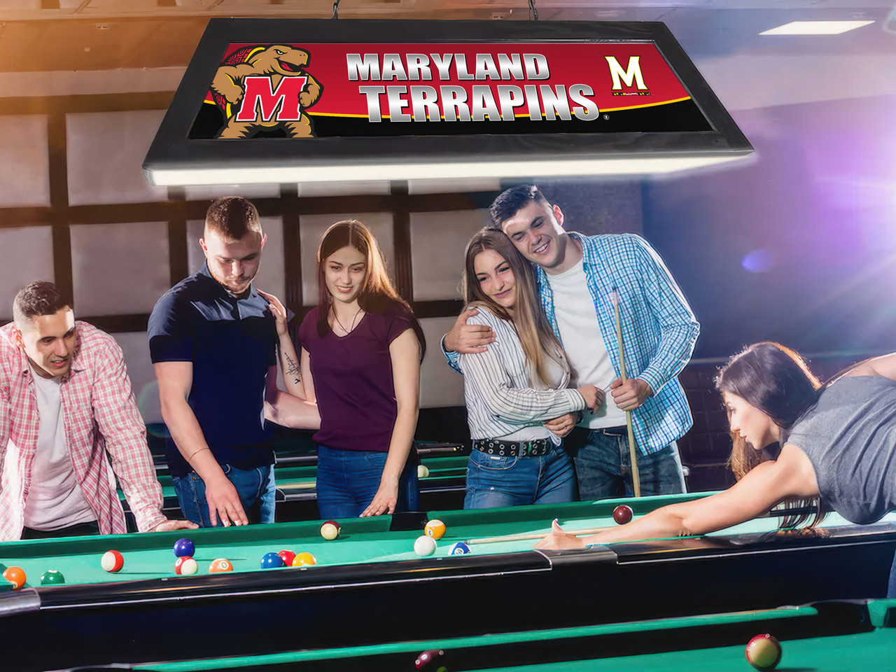 Lifestyle view of the Maryland Terrapins 42-inch hanging billiard table light installed above a pool table, demonstrating its appearance in a game room, billiard room, home bar, or Terrapins fan cave.