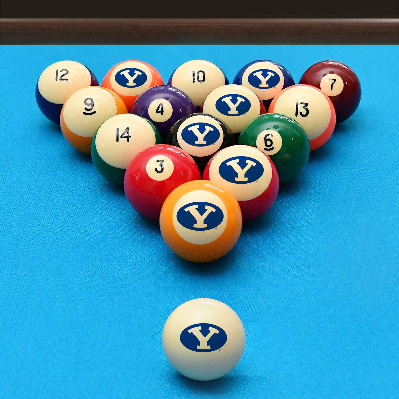BYU Cougars billiard balls arranged in a triangle rack on blue pool table felt, featuring oval “Y” graphics with a coordinating BYU cue ball positioned in the foreground.