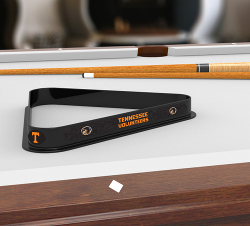 Tennessee Volunteers billiard triangle displayed on a pool table beneath billiard cues, showcasing the black frame, bright orange Tennessee graphics, and Power T logo in a game room setting.