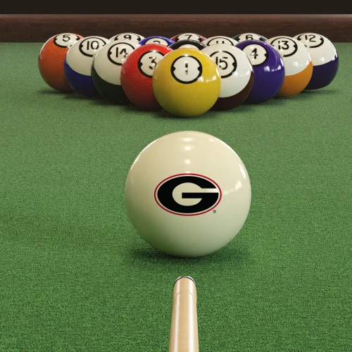 Georgia Bulldogs cue ball positioned on green pool table felt in front of a racked set of billiard balls, featuring the Georgia Power G logo with a pool cue lined up for the break.