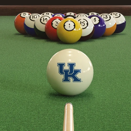 Kentucky Wildcats cue ball positioned on green pool table felt in front of a racked set of billiard balls, featuring the blue and white UK logo with a pool cue lined up for the break.
