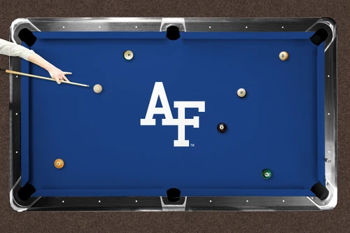 Air Force Falcons logo billiard cloth shown installed on a full-size pool table with blue playing surface, centered white AF team logo, billiard balls in play, and a player preparing to take a shot.
