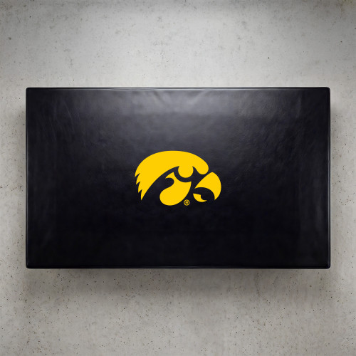 Iowa Hawkeyes pool table cover shown from above, featuring a black cover design with the yellow Iowa Hawkeyes logo centered on the surface. This NCAA billiard table cover is designed to protect the table while showcasing University of Iowa team pride.