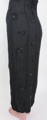 Side/back view of dress with hand beaded seams.