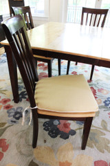Coordinating seat cushions in Kravet Linen 32330 14 with welting in Makers Mark.