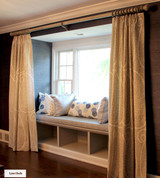 Schumacher Ambala Paisley Fog Drapes with Western Wood Supply Drapery Hardware Painted in Old Ivory.   Cushion in Schumacher Travertine Linen Weave in Denim.  Pillows in Groundworks Kasa and Christopher Farr Pollen. (Erika Mercurio Design)