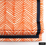 Roman Shade in Zig Zag Orange on Tint with Samuel & Sons Grosgrain Trim in Navy