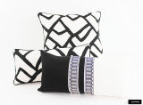 Pillows in Zimba Ebony with Black Welting.  Black and White Pillow has Schumacher Arches Trim in Center.