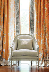 Drapes in Chinois Palais in Tangerine trimmed with Labyrinth Tape in Dove 6" Wide.  Pillow with Madame Wu Applique in Swan.  Chair in Honeycomb in Swan.
