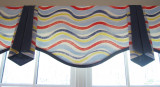 This is a Valance I designed.  It is a simple style with a serpentine bottom with separate side pieces that are lined with a contrasting color.