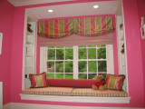 My custom valance, roman shades, window seat cushions, bolsters and pillows appeared in At Home Magazine.