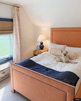 Brunschwig & Fils Les Touches Tangerine Drapes with Matching Bolster  in Bedroom