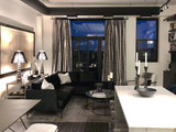 Schumacher Full Circle Custom Drapes in Living Room in Faded Black