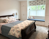 Schumacher Poppy Hand Block Print Roman Shade in Bedroom (shown in Rose & Sky)