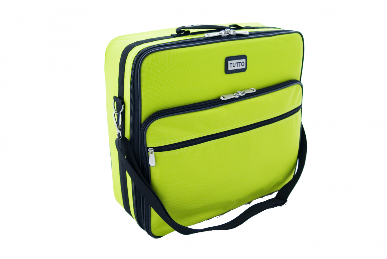 Holds embroidery unit, hoops, fabric, computer supplies, and fills pockets with sewing notions to your heart content.