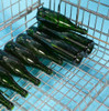 Wired bottom positioning grid to ensure proper positioning of the first four layers of bottles onto the bottom of the cage.