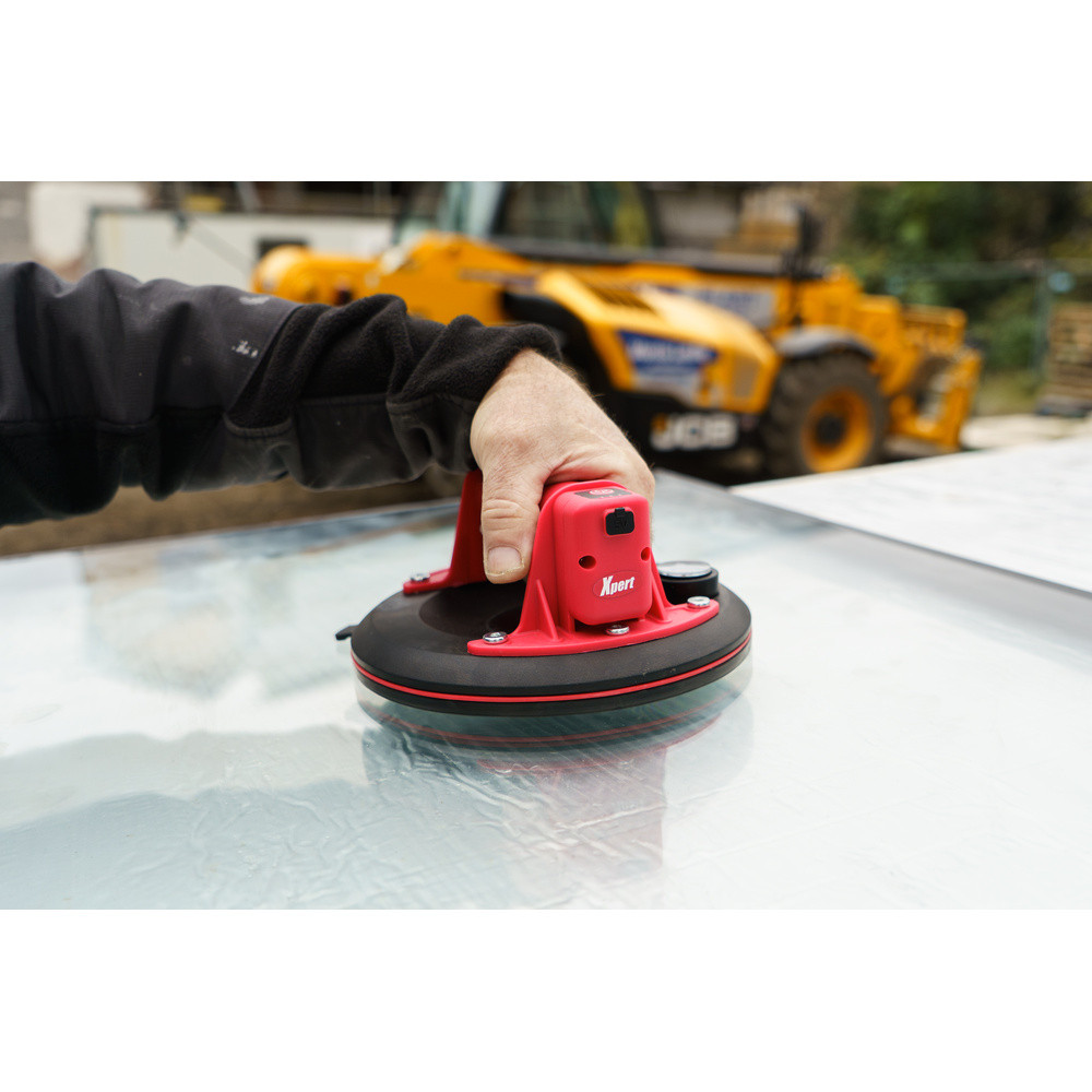 Xpert PowerLift suction pad attached to a horizontal glass pane