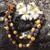 Purple and Yellow Kukui Nut Lei - 10 Leis per Order