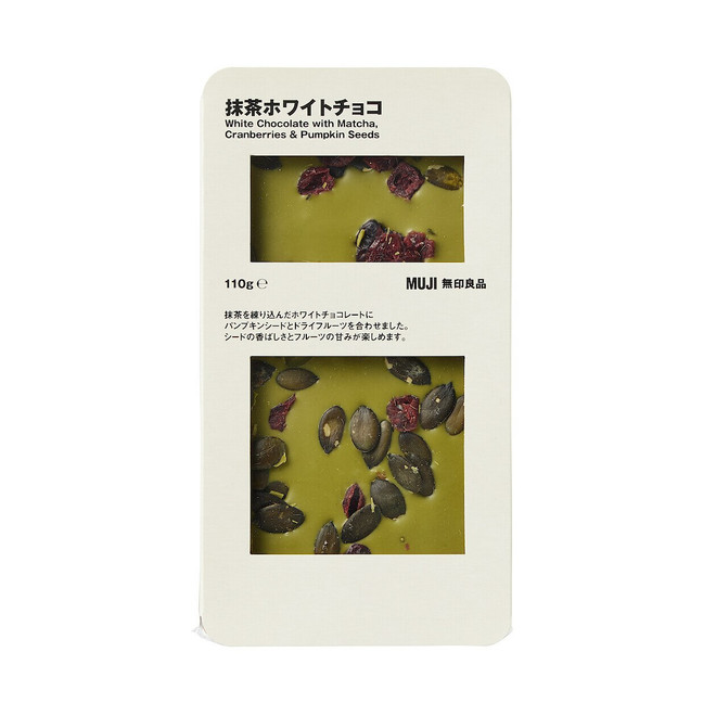 Chocolate blanco con arándanos rojos endulzados, semillas de calabaza y té verde matcha.