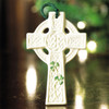 Belleek St. Kieran's Cross Ornament hanging on a Christmas tree