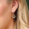 Éireloom 14K Gold Claddagh Earrings shown on a model